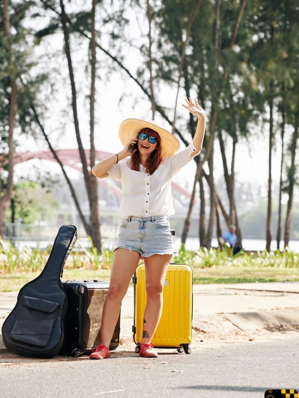 female-traveler-trying-to-chatch-car
